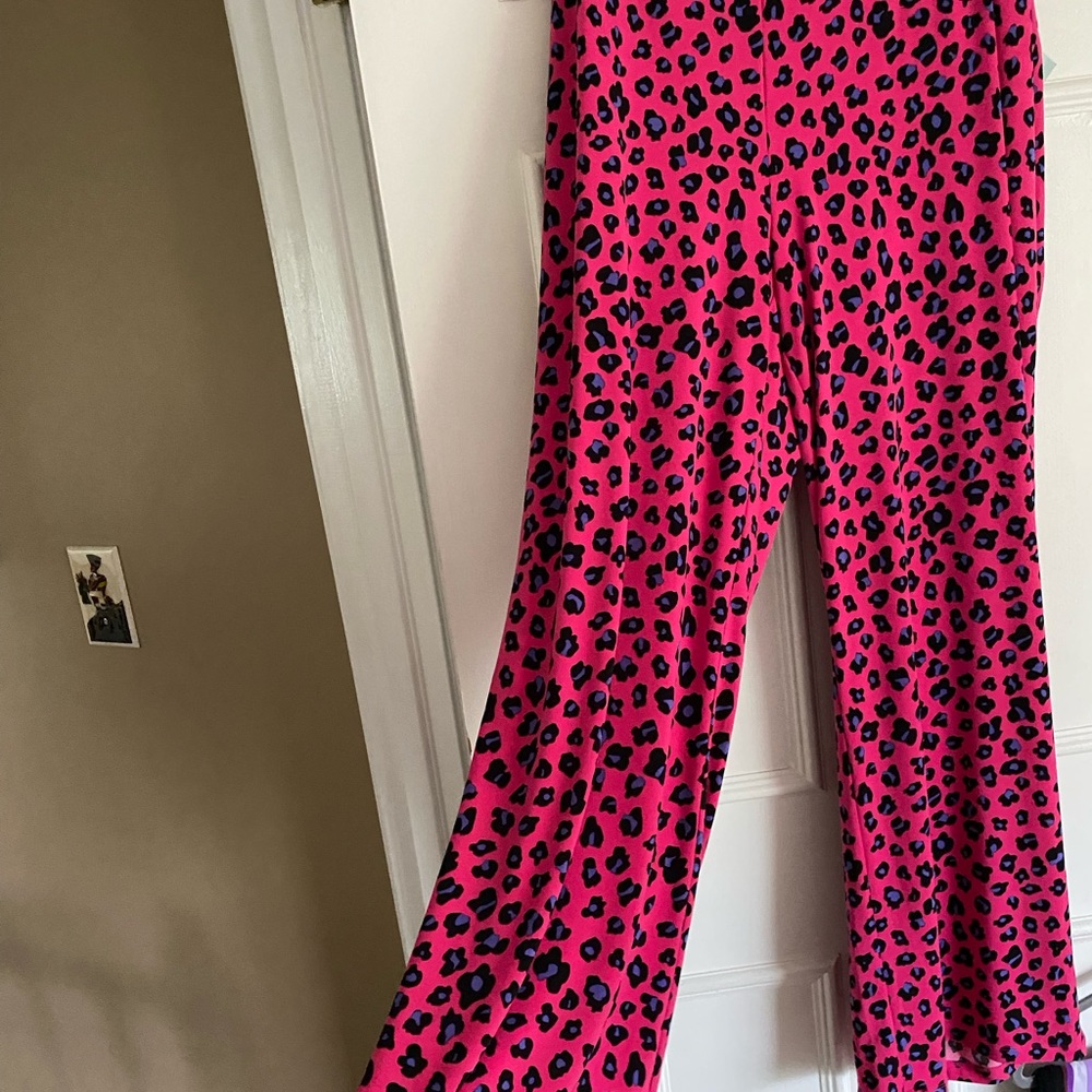 Cute animal print wide leg pants.. Bright pink with purple, black & white print.